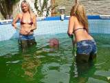 Christina and Nikki in Jeans and Waders cleaning pool