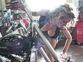 Instead of cleaning the Harley, she prefers to jerk him off