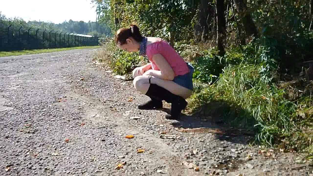 A Beautiful Girl Peeing Side Of The Road
