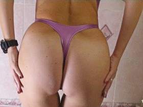 Alina takes a shower in purple Realise rubber swimsuit