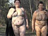 Lesbians run in lingerie in the forest