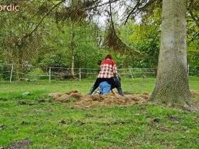 Rubber boot mistress pushes slave's face into the dung