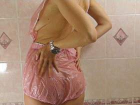 Christina takes a shower in pink AB PVC Outdit