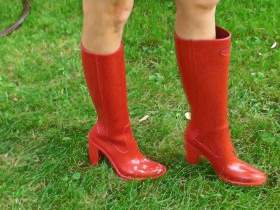 Lacquer, latex and rubber boots in the garden