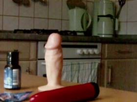 Dildo fucked on the kitchen table and cumshot