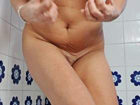 Peeing with a mini dildo in the ass