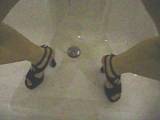 Piss in the tub with high heels!