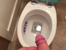 My horny cock pissing in the toilet