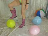 Nikki blows up balloons and letting it burst