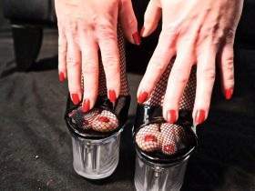Fishnet stockings and red fingernails