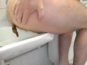 Shitting 8 - He is shitting in the bathroom sink