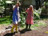 Gardening in smocks and rubber boots