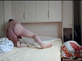 Naked nylon boy makes his bed 1