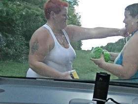 Fat women wash a car 1