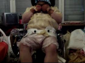 strapped into the chair at full diaper