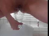 Teeny pissing in the glass