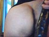 Italian wife: Huge black dildo between her buttocks and in her hairy pussy