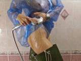 Christina takes a shower in blue PVC and Waders